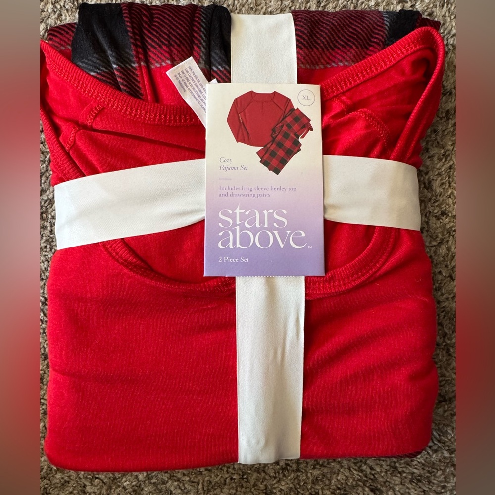 Stars above women’s red checkered PJs. Size XL new in packaging.